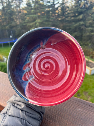 A red and black glazed bowl